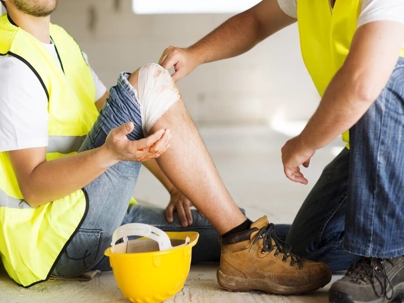 an injured worker with a bandaged knee